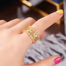 BRAIDED GOLDEN ZIRCONIA RING